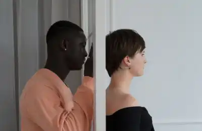 man staring at partner through door