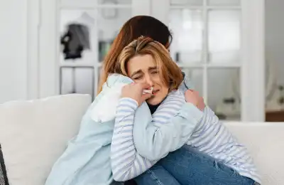 female couple crying and hugging
