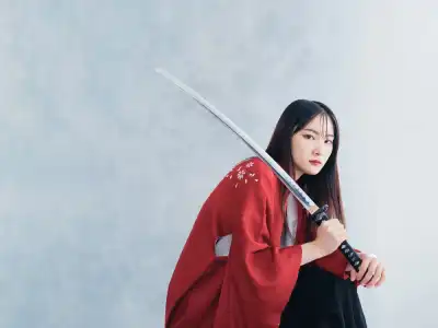 Female Samurai Holding Sword and Looking at the Camera.