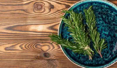 Fresh rosemary on a plate, ready for use in herbal recipes