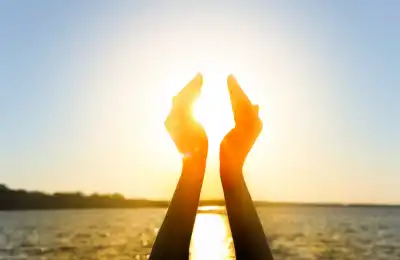 An image of someone holding the sun.