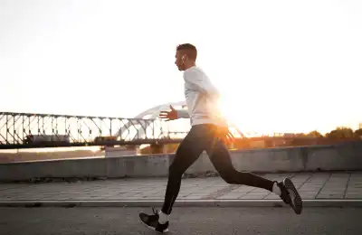 Man running at sunrise