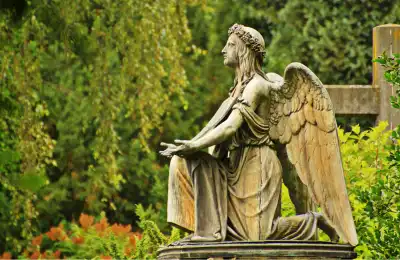Archangel Raphael kneeling statue