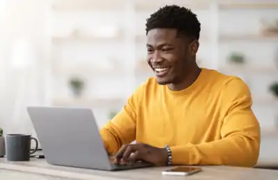 Image of someone working on their laptop.