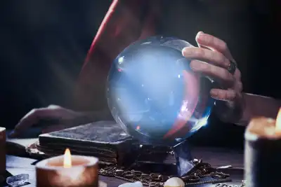 Someone using a crystal ball for a psychic reading