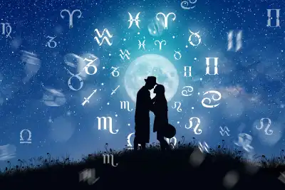 Silhouettes of a man and woman in front of a moon and starry sky, surrounded by the zodiac signs