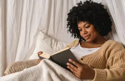 Woman reading in bed