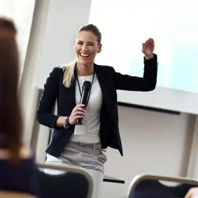 smiling woman giving a speech