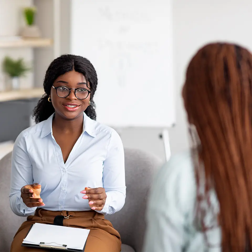 A counsellor talking with a client during a counselling session