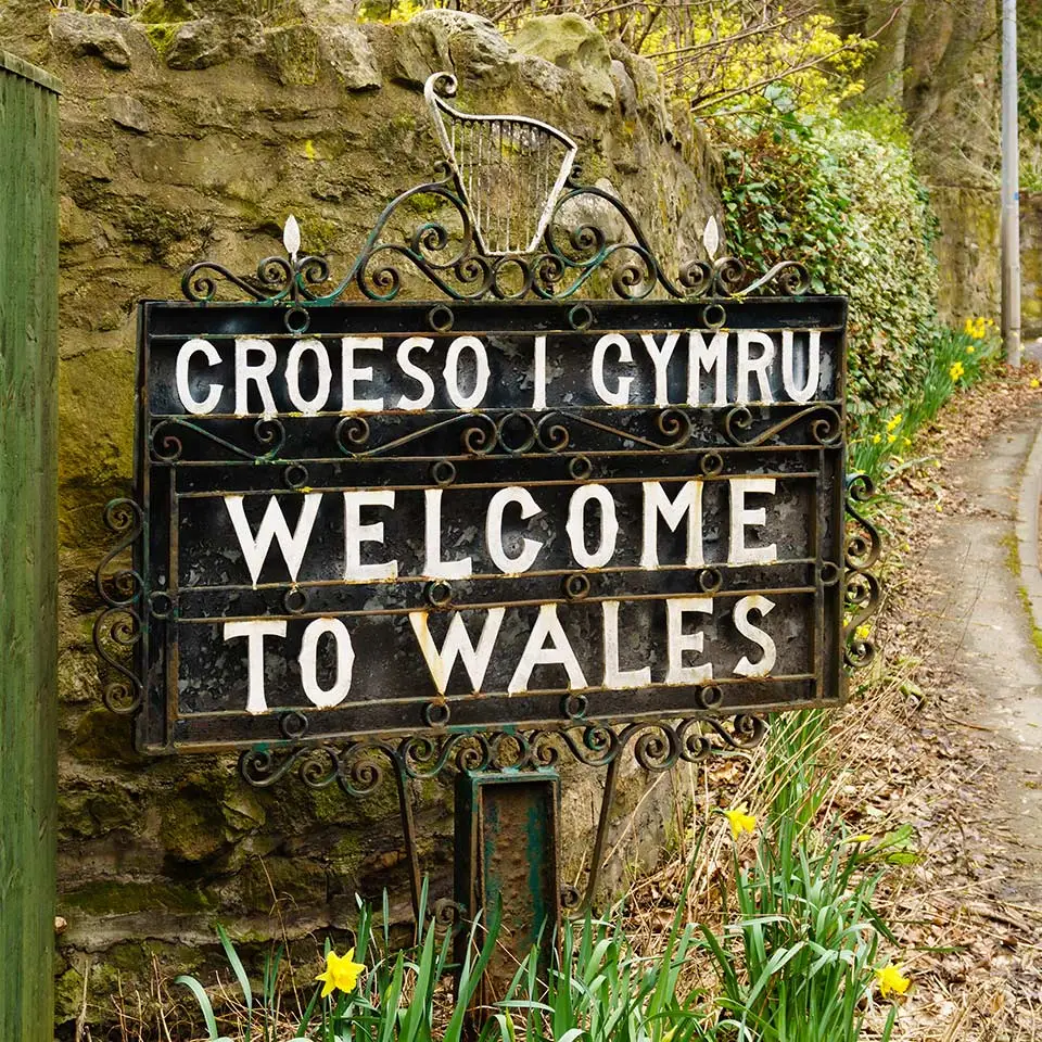 Bilingual Welcome to Wales sign in Welsh and English marking the border between England and Wales
