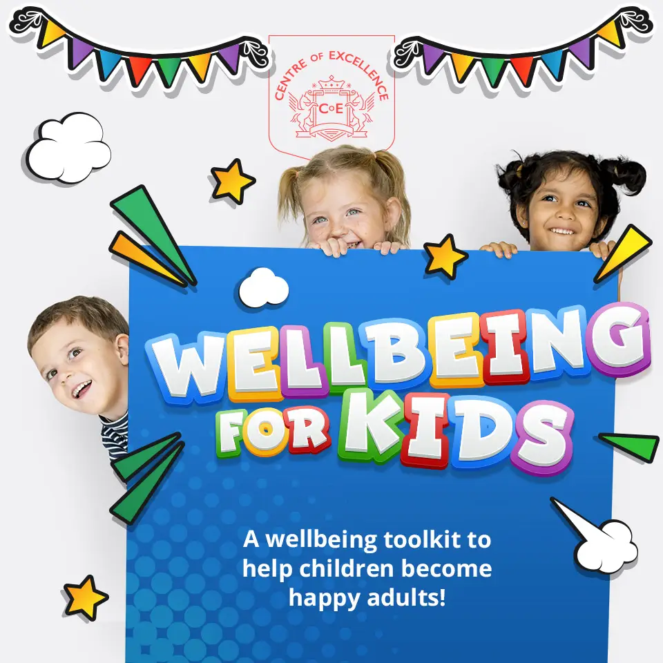Children peeking from behind a blue box with the words Wellbeing for Kids A wellbeing toolkit to help children become happy adults! written on it