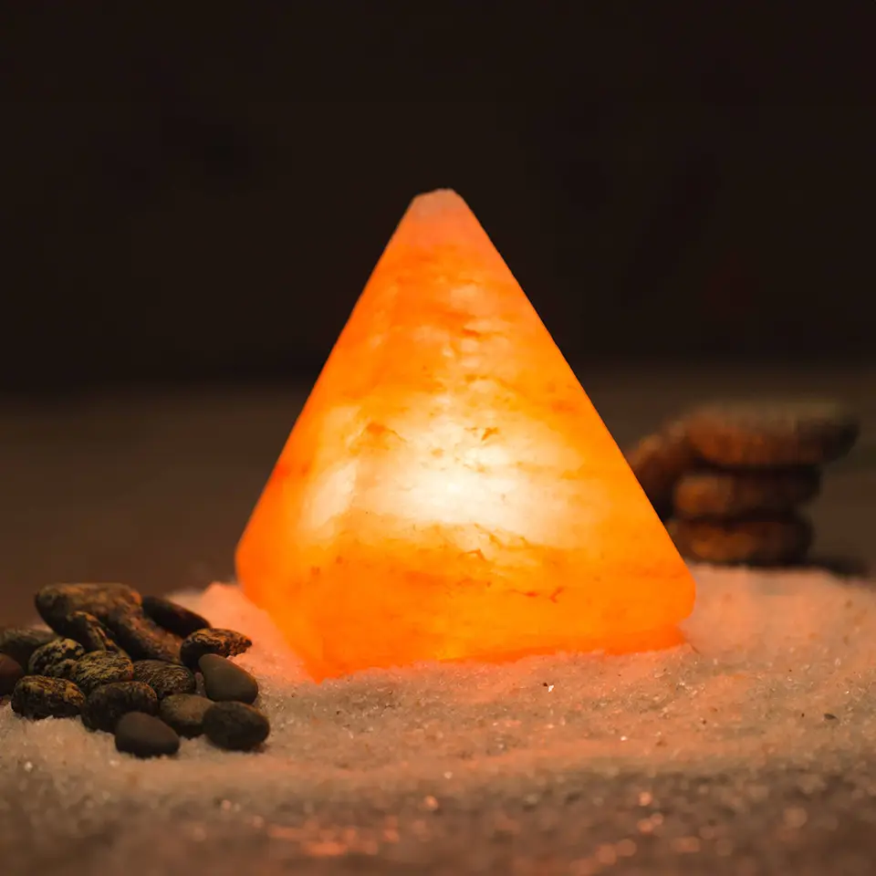 Himalayan pink salt lamp on table useful for asthma treatment Halotherapy