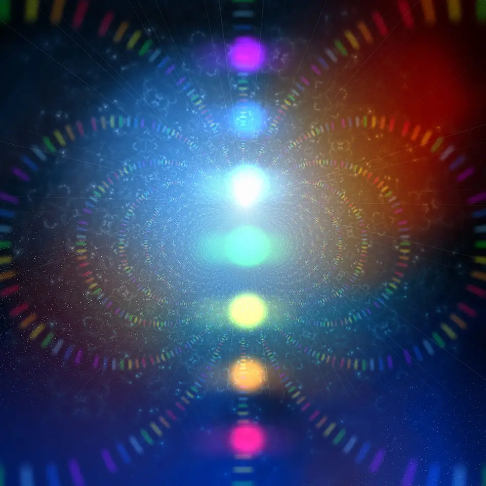 Illustration of the 7 chakras presented as coloured glowing orbs of light