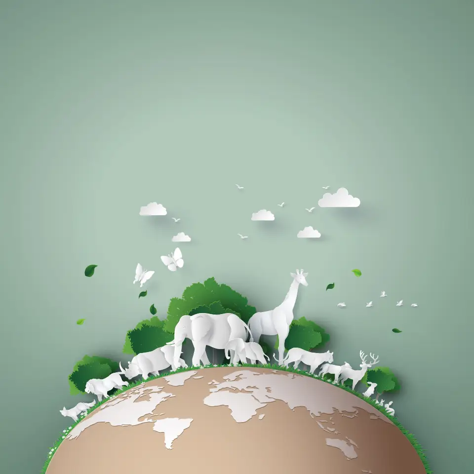 Illustration of a paper Earth covered with paper animals and trees