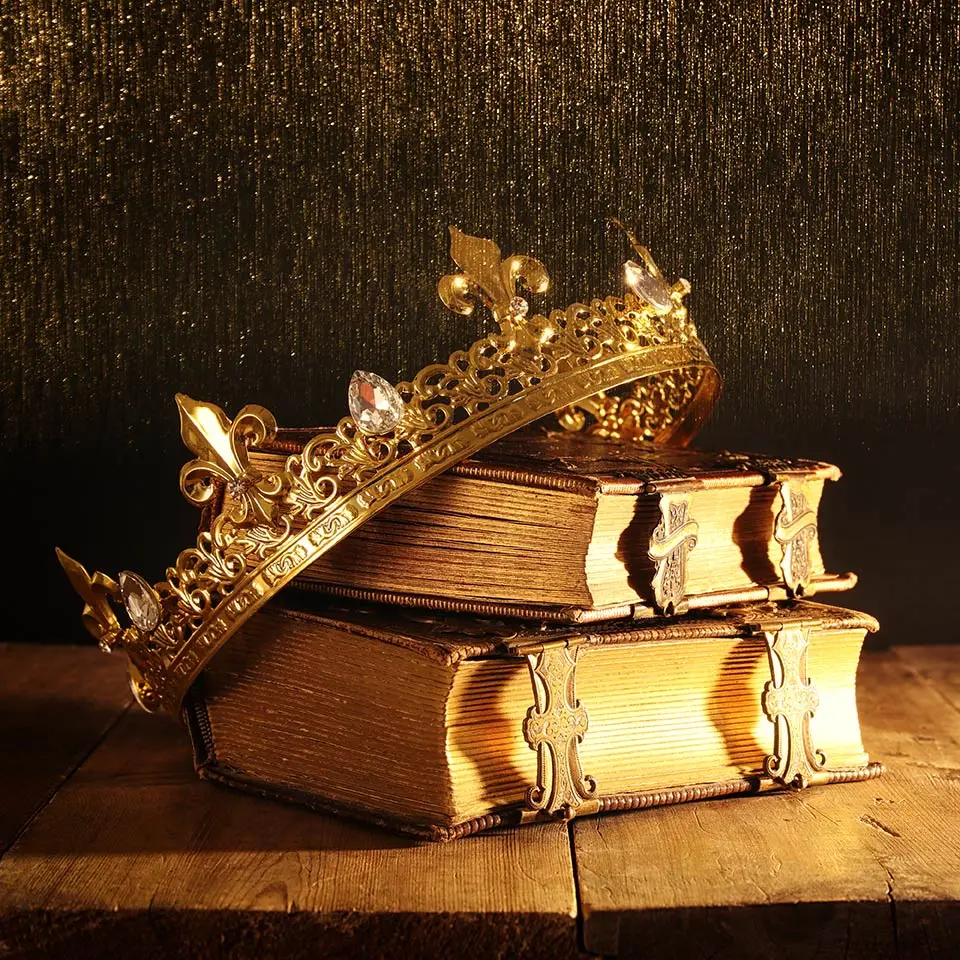 Medieval crown balanced atop some old books