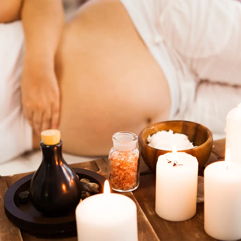 Pregnant woman relaxing at a spa.