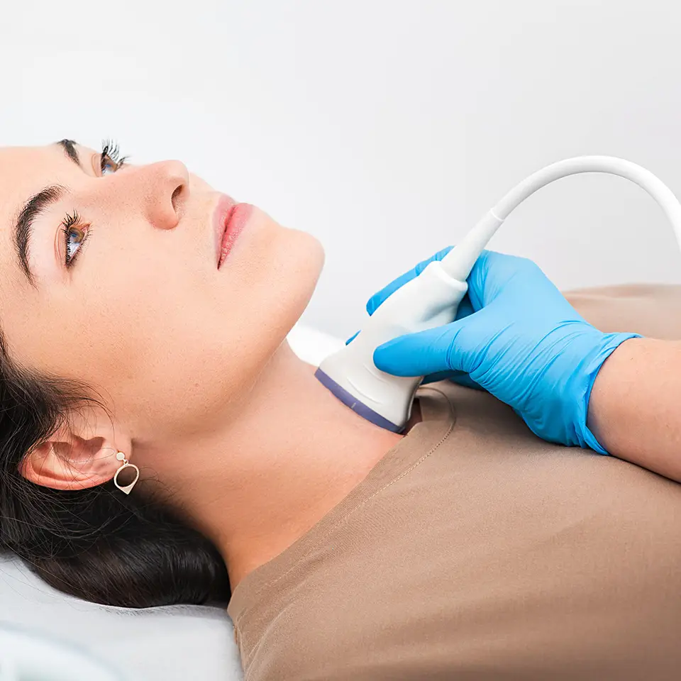 Woman patient receiving thyroid diagnostics
