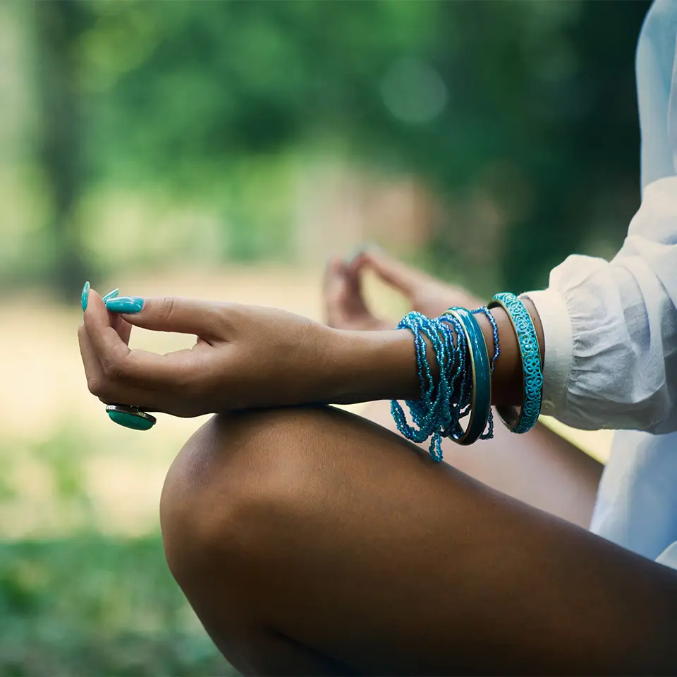 A woman’s hands in a meditation pose