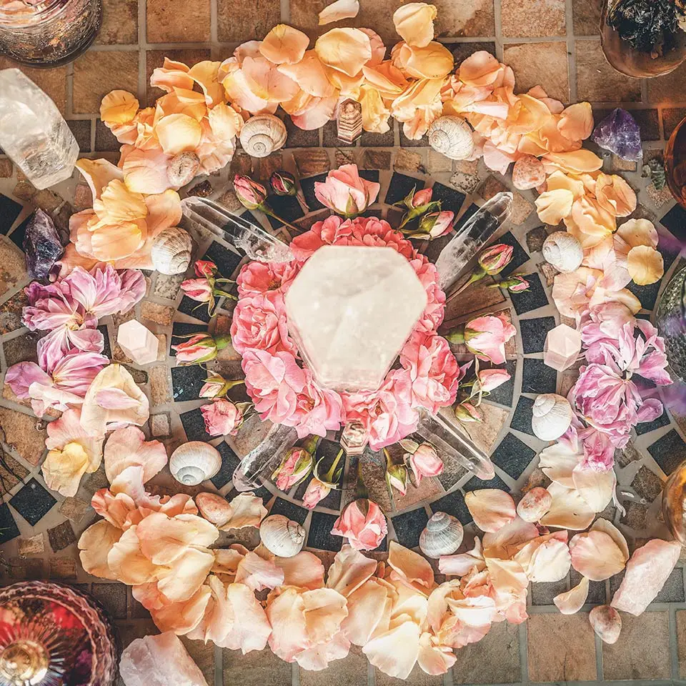 Circular altar with crystals and rose petals