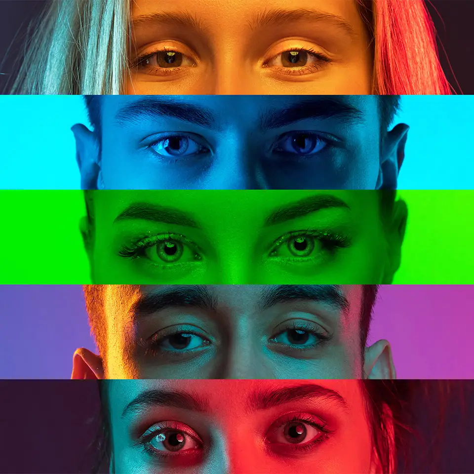 Collage of male and female eyes isolated on a multi-coloured neon background