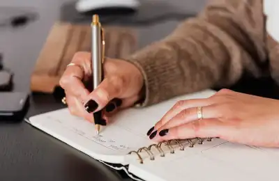 Image of someone writing.