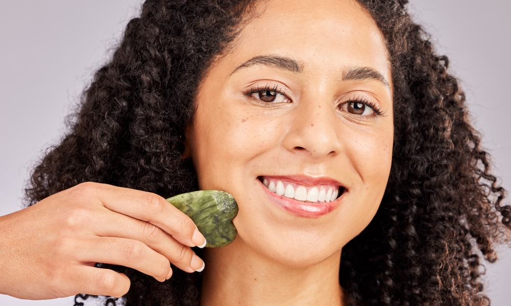 Woman using gua sha