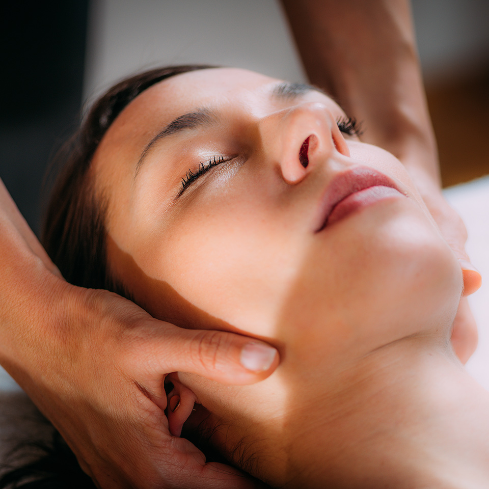 Therapist providing cranial osteopathy massage