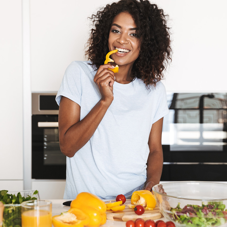 Woman making a vegan ketogenic meal in the kitchen