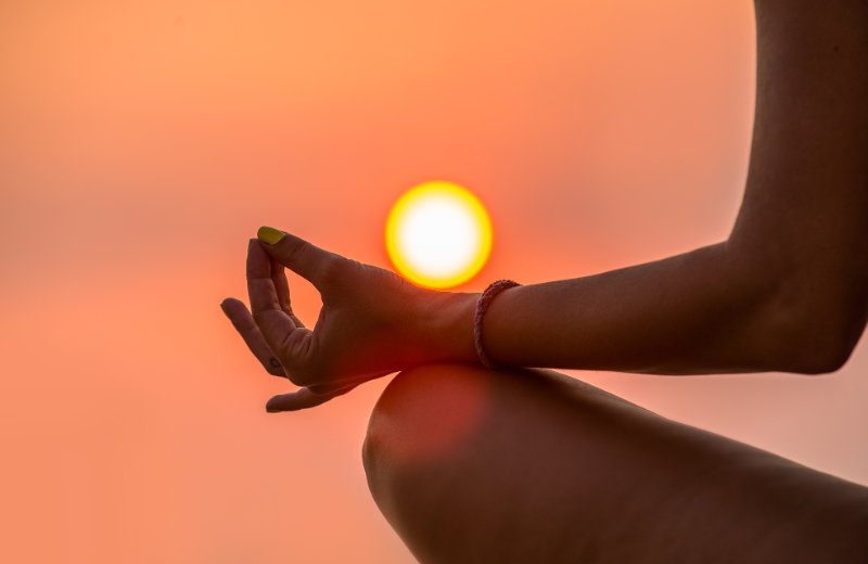 Meditating at sunset