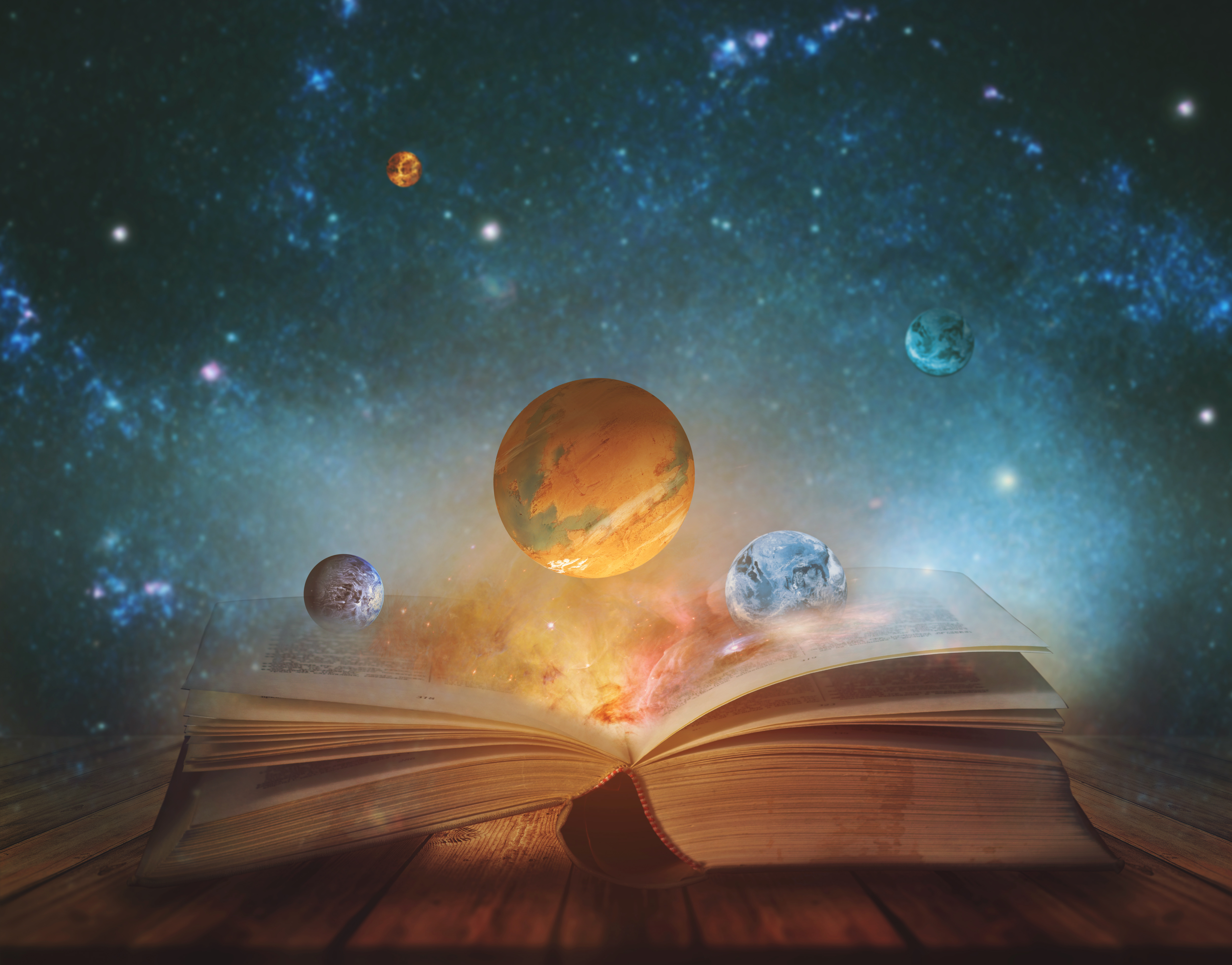 An image of planets and an open book