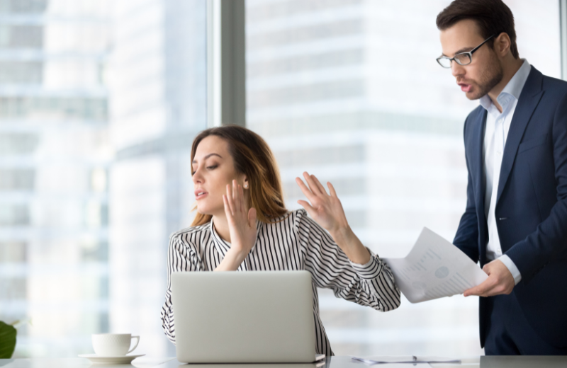 woman dismissing man at work