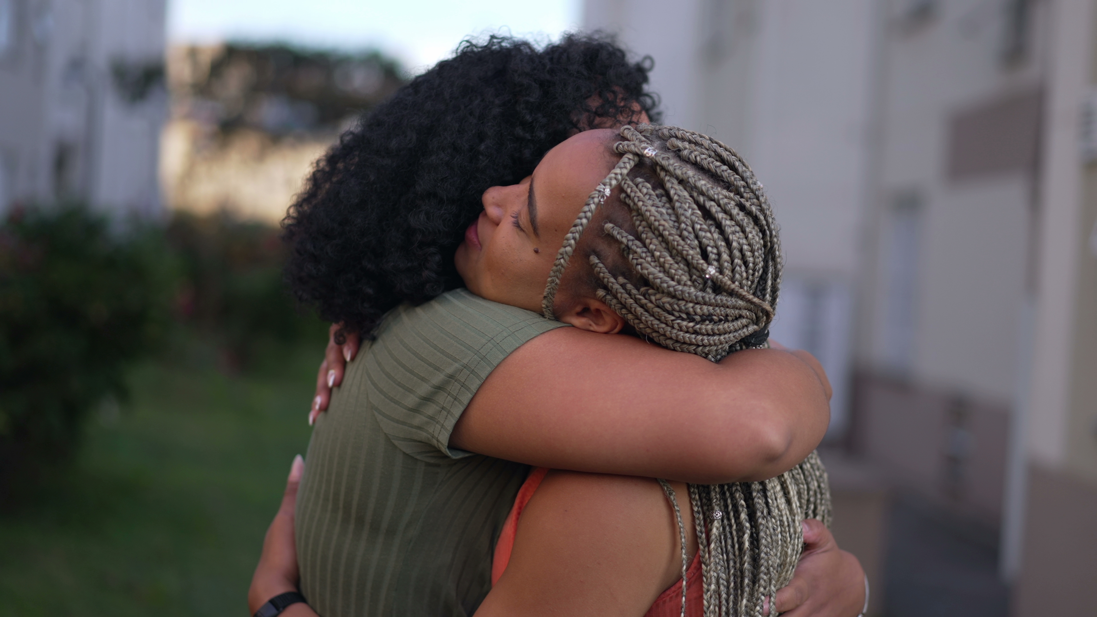 Two friends hugging to show empathy