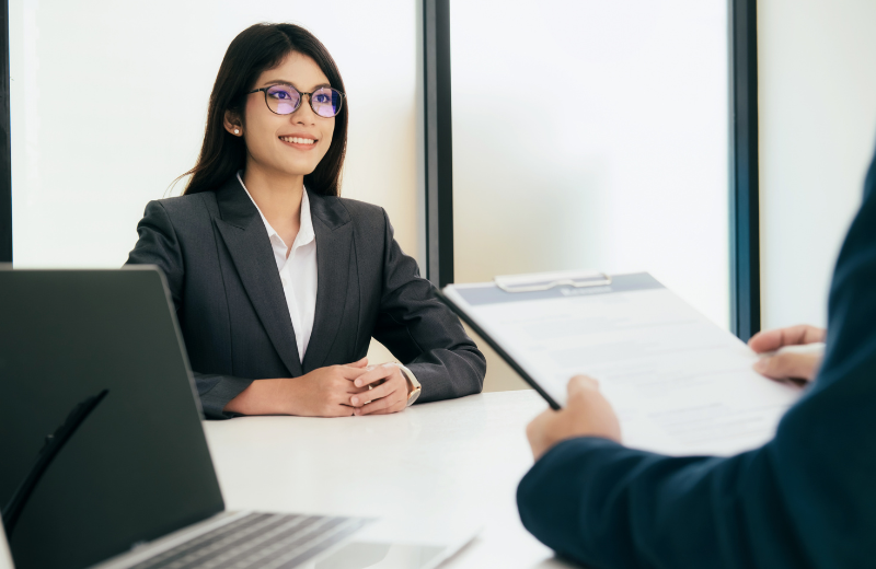 Image of someone wearing a black suit to a job interview.
