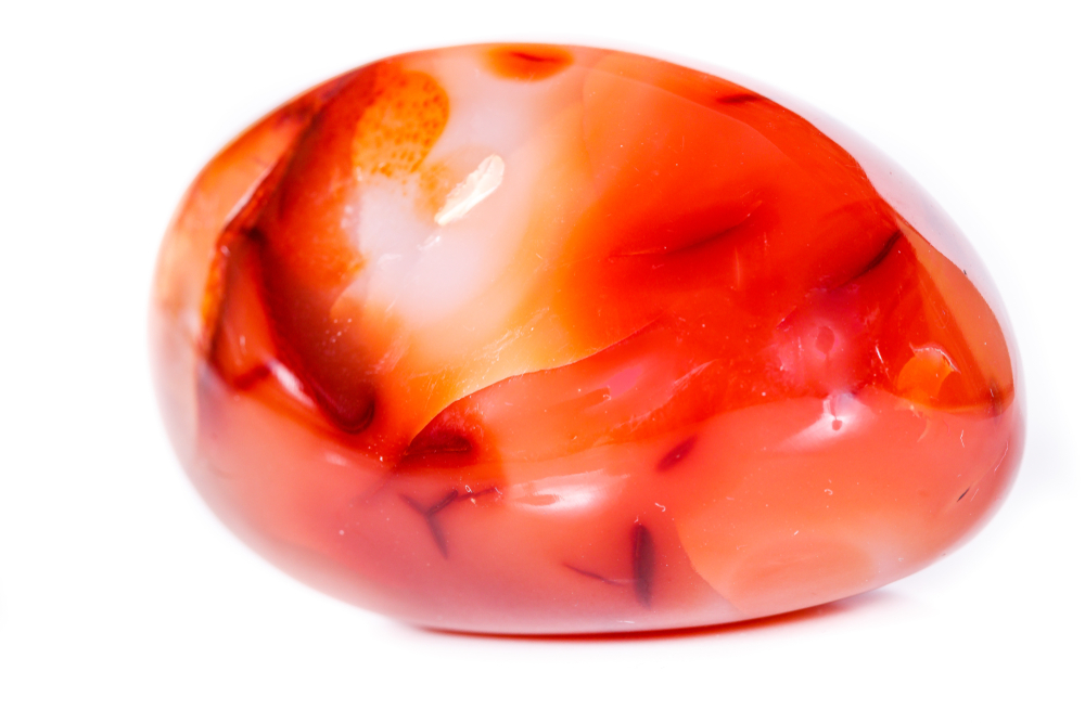 A piece of Carnelian on a white background