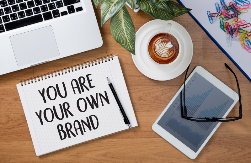 Image of a notebook that says 'you are your own brand.'