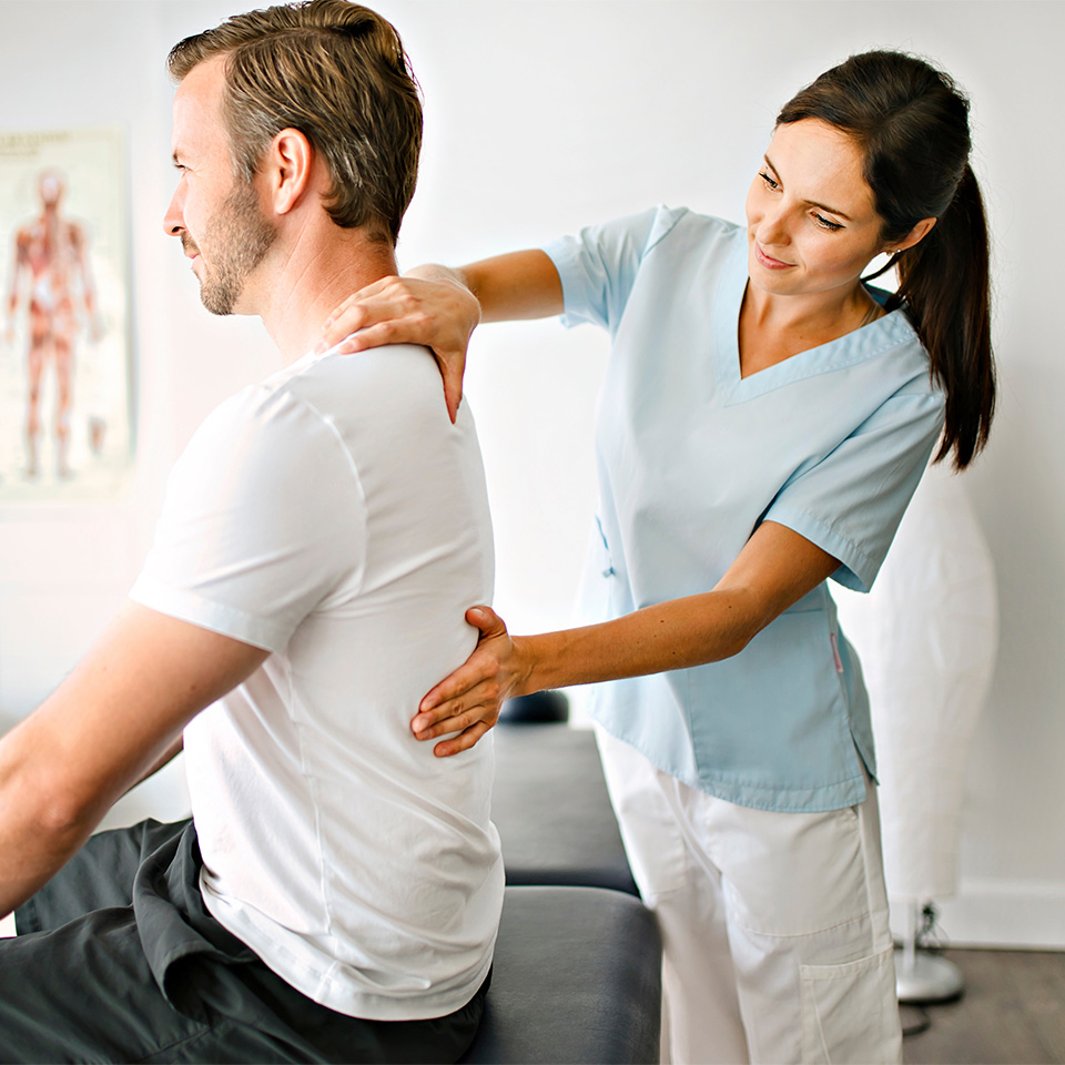 A physiotherapist treating a patient