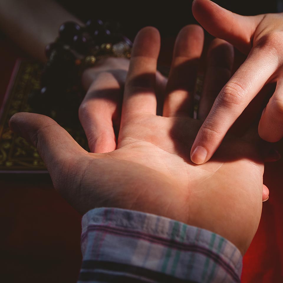 A person having their palm read.