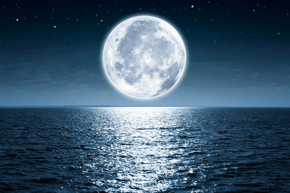 A full moon above the sea