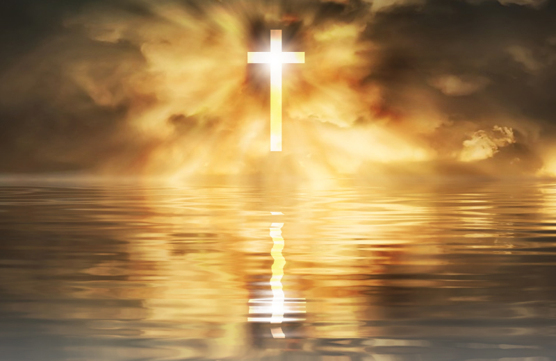 Christian Cross reflected in water