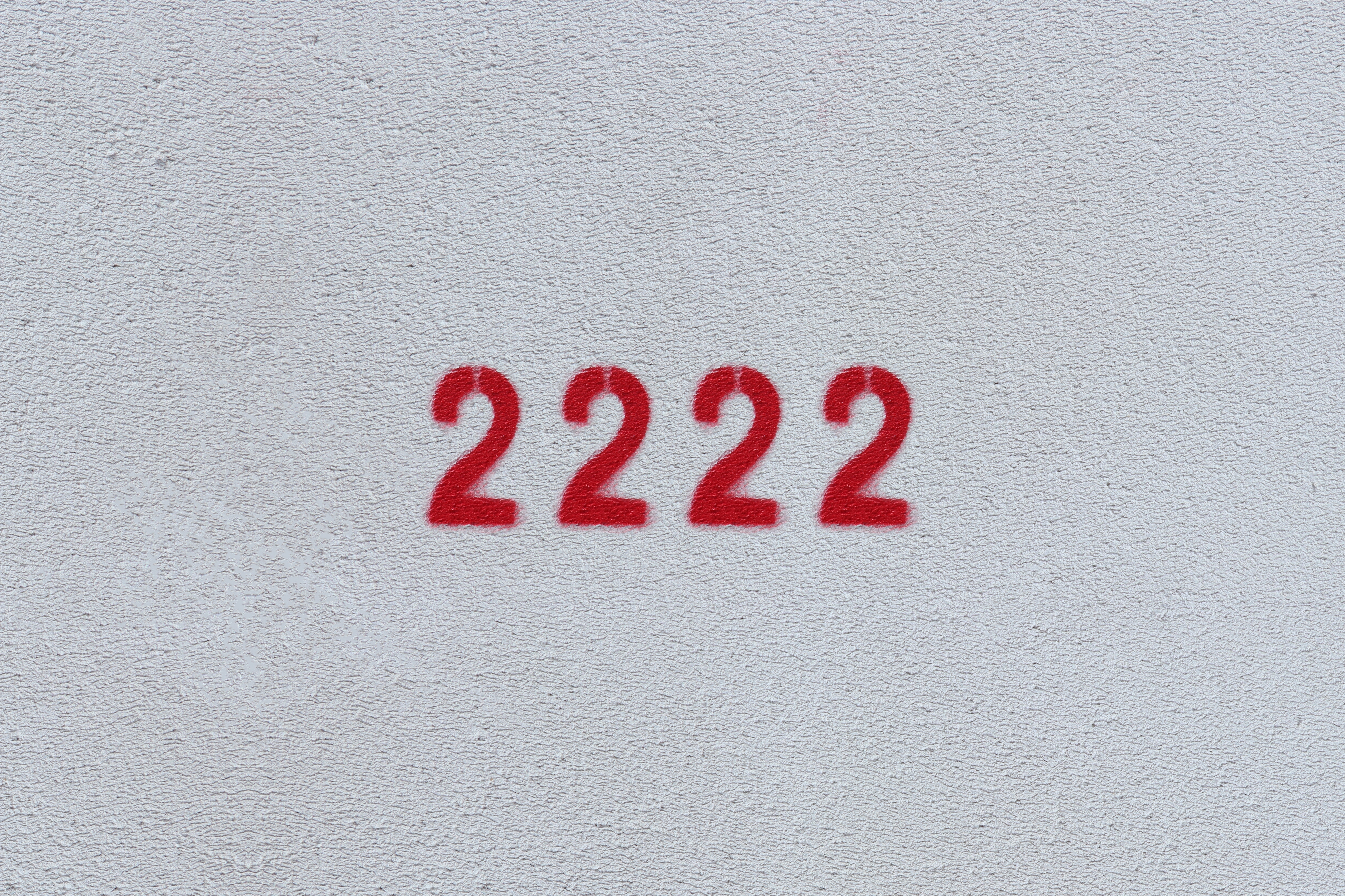 A white background with '2222' written in red