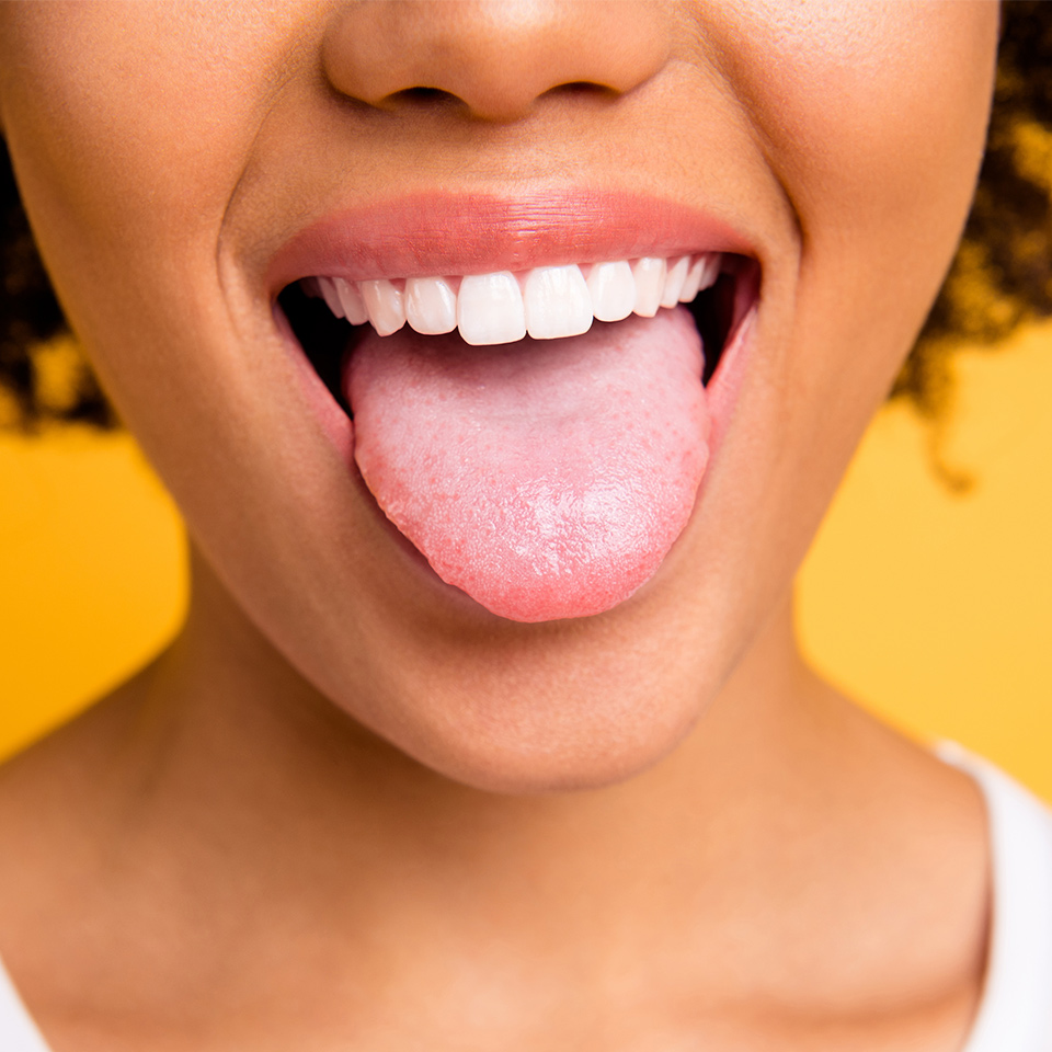 Cropped close up of a person with their tongue out