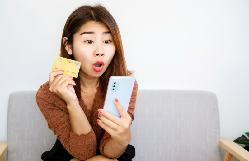 impulsive woman using credit card