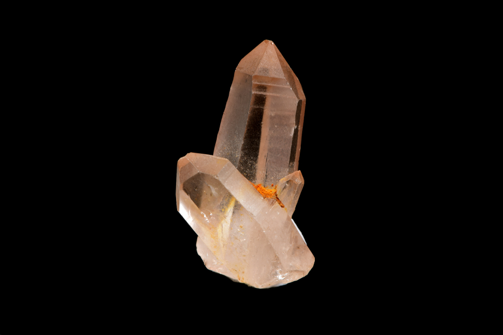 A piece of Pink Lemurian Quartz on a black background