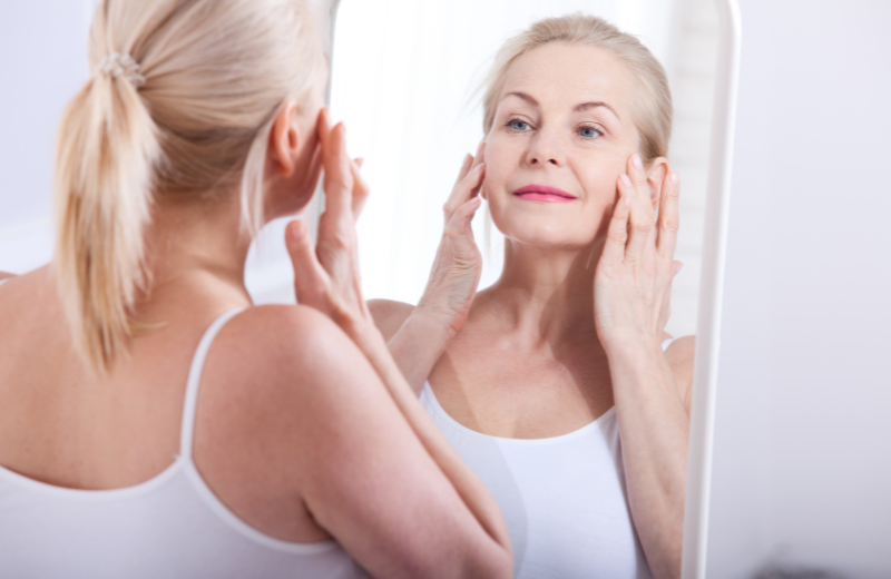Image of someone looking in the mirror.