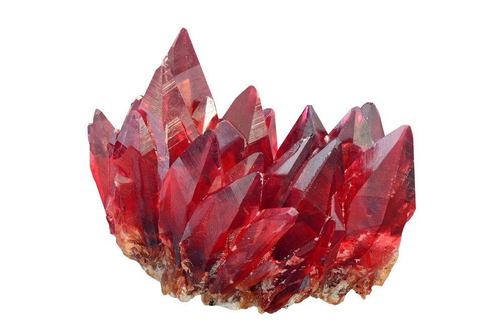 A piece of Rhodochrosite on a white background