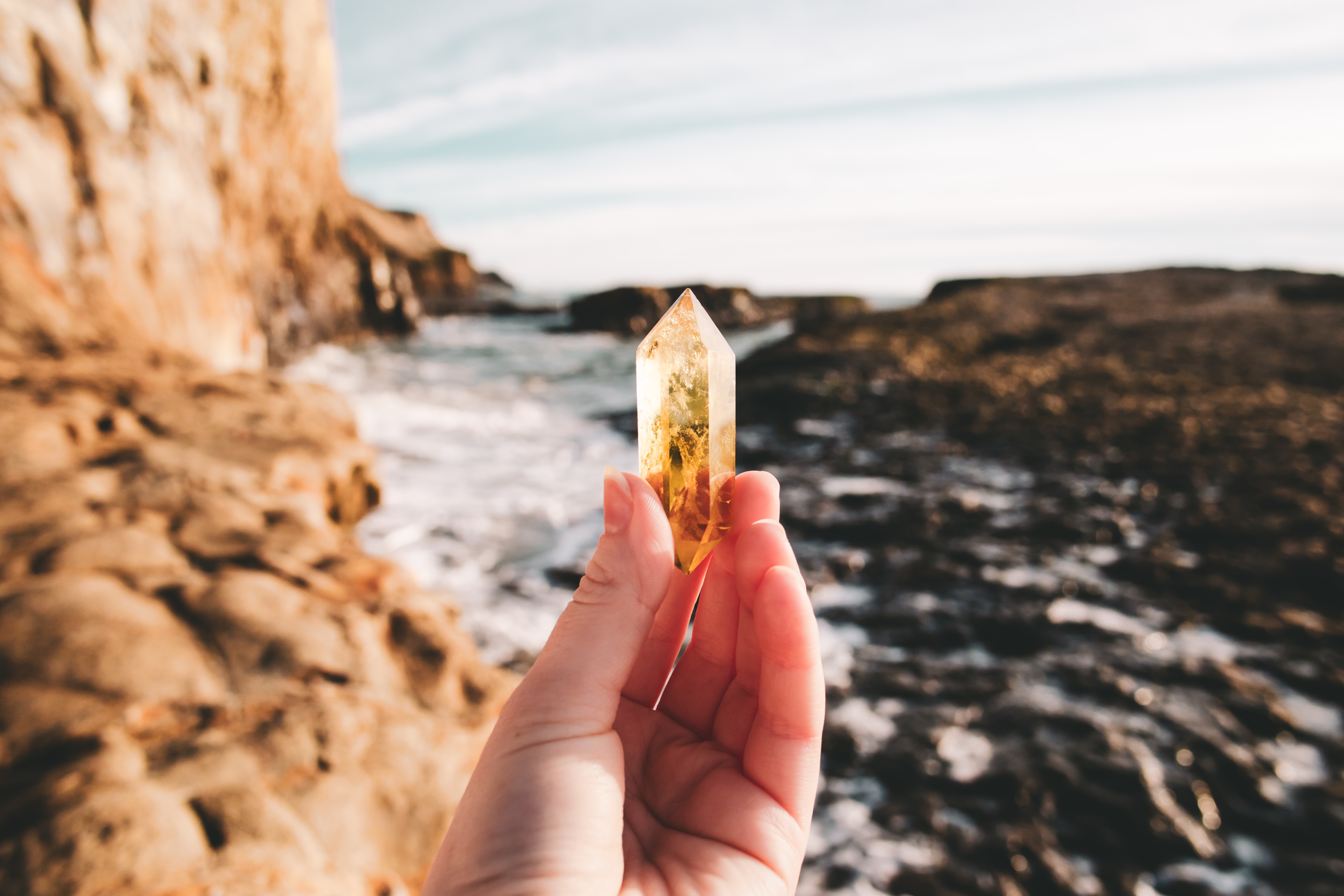 Someone holding a piece of Citrine