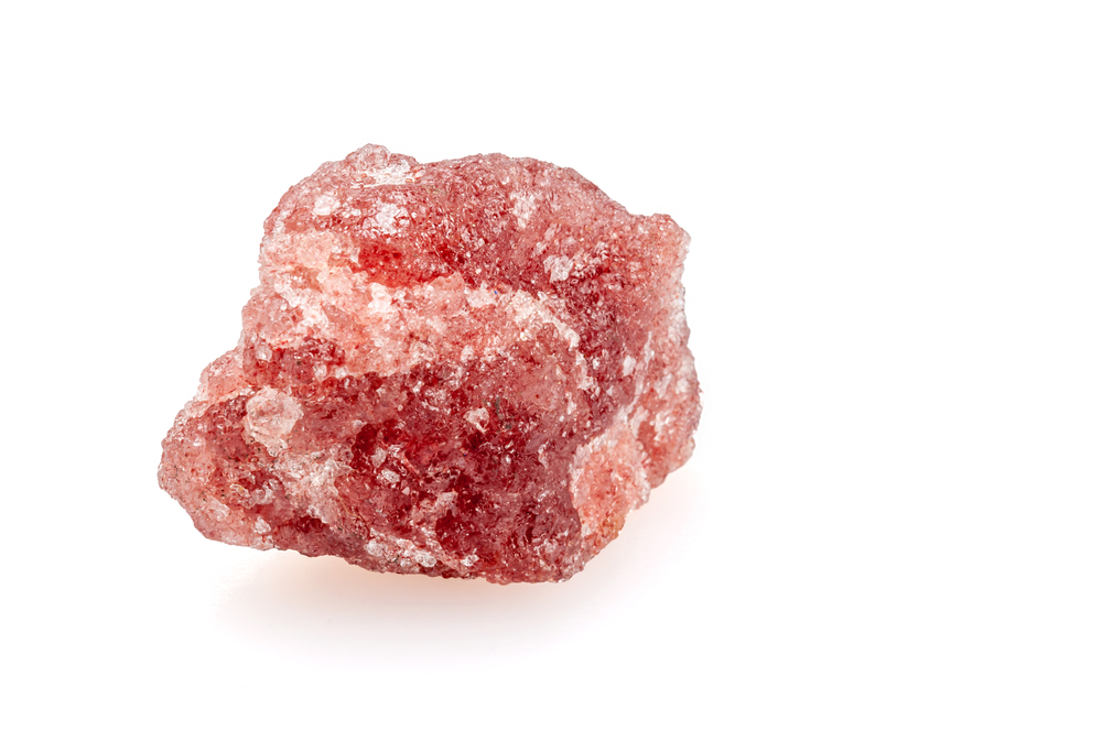 A piece of Cherry Quartz on a white background