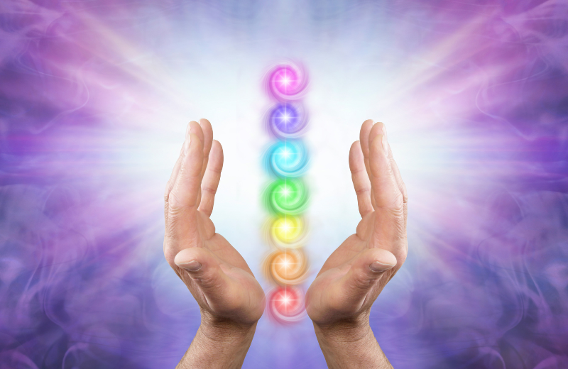 Image of the chakras and healing hands.