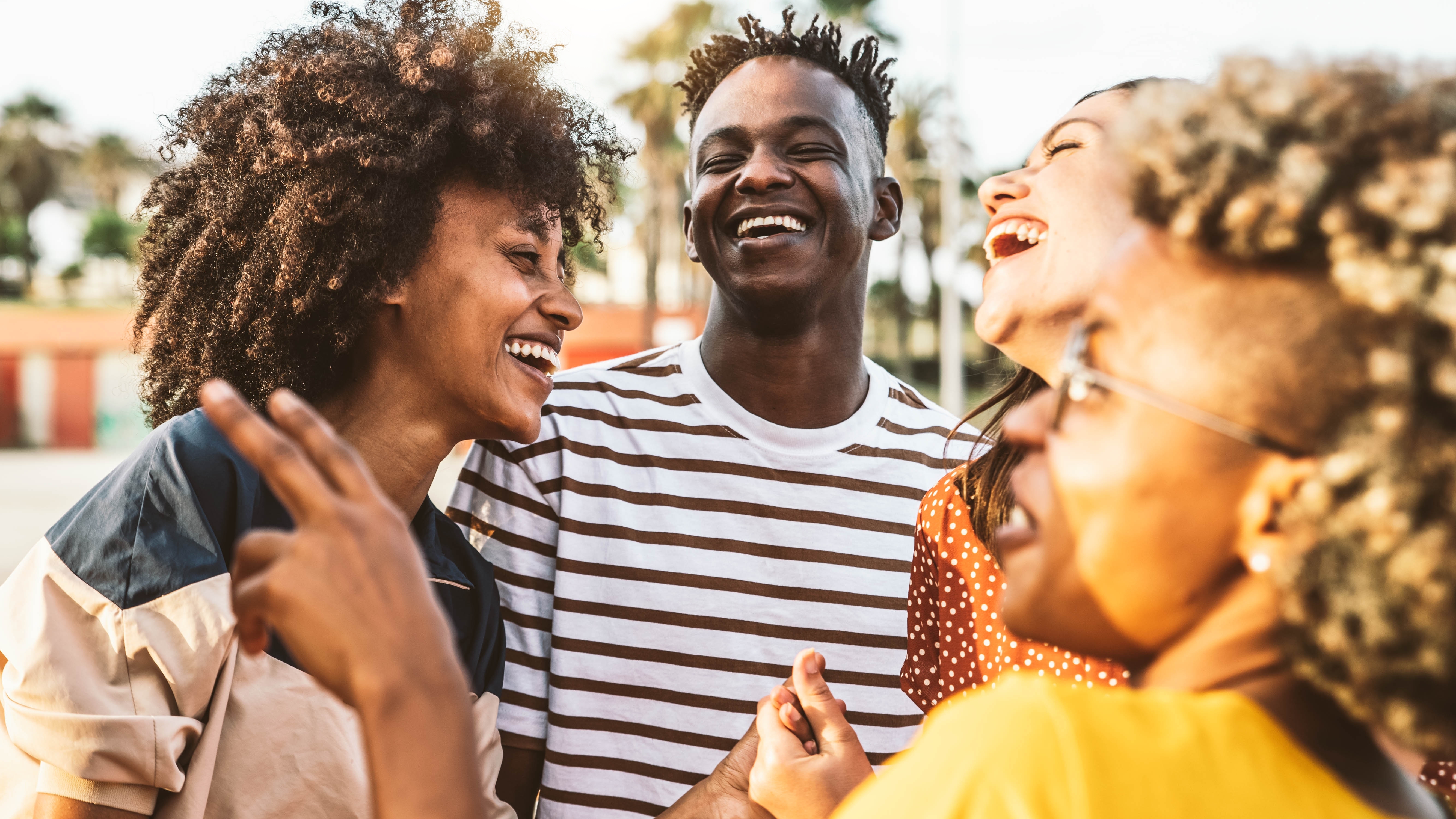 Diverse friendship group laughing together