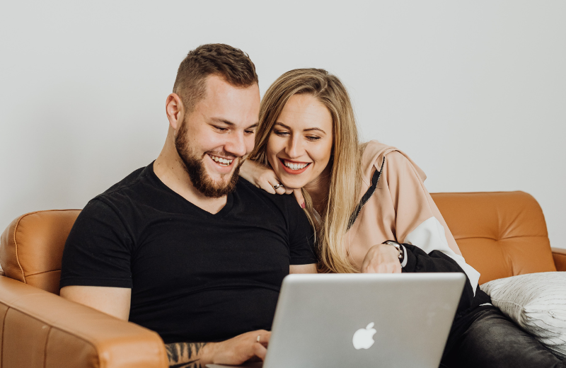 Image of a couple sitting together on the couch.